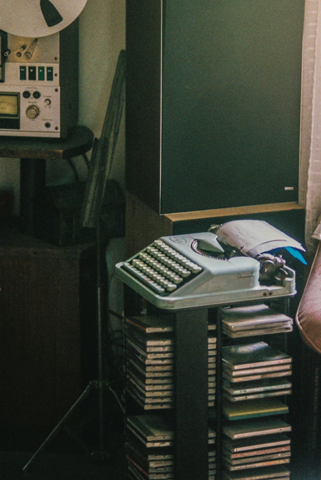 Vintage film editing desk with reels and a small broadcast monitor used for commercial production