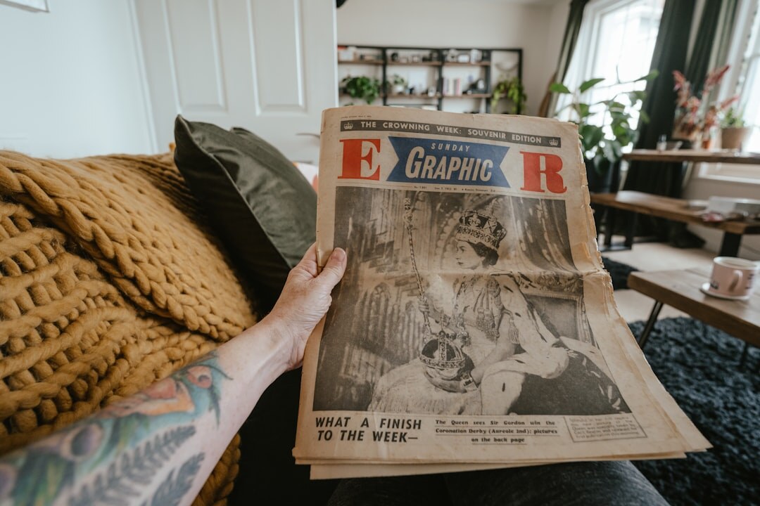 person reading old magazine ads