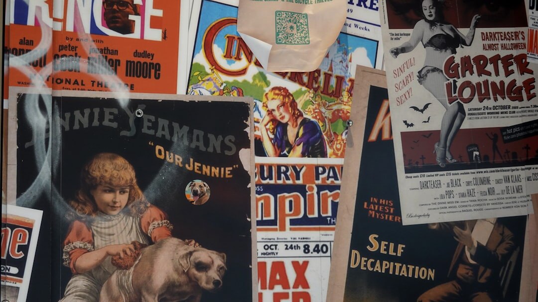 Stack of vintage advertising magazines and printed posters from the 1980s and 1990s